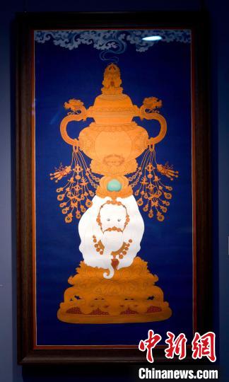 圖為5月16日，展覽中的新創(chuàng)唐卡作品《瑞象承香》?！±盍?攝